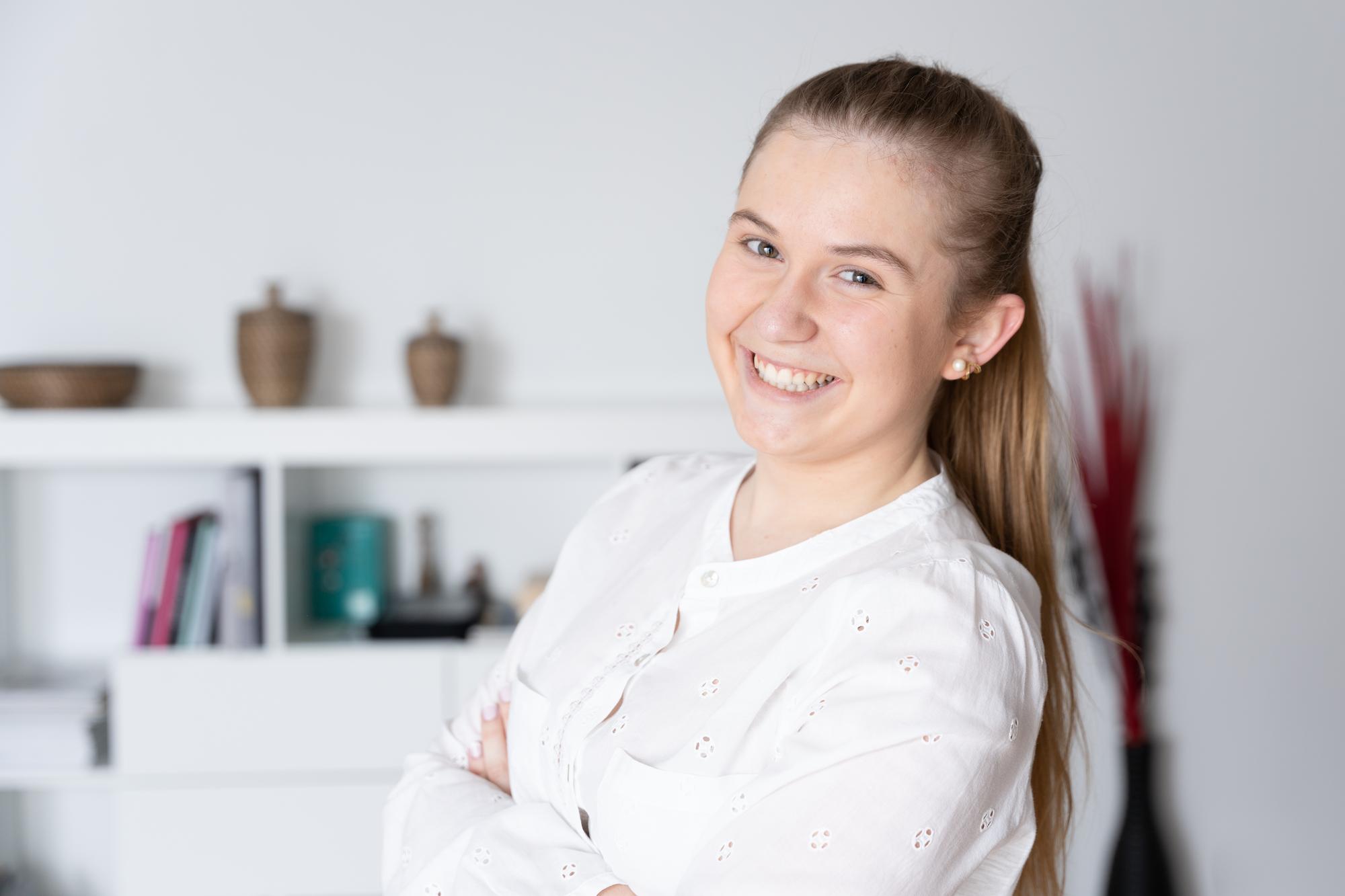Workshop host smiling in a light kitchen
